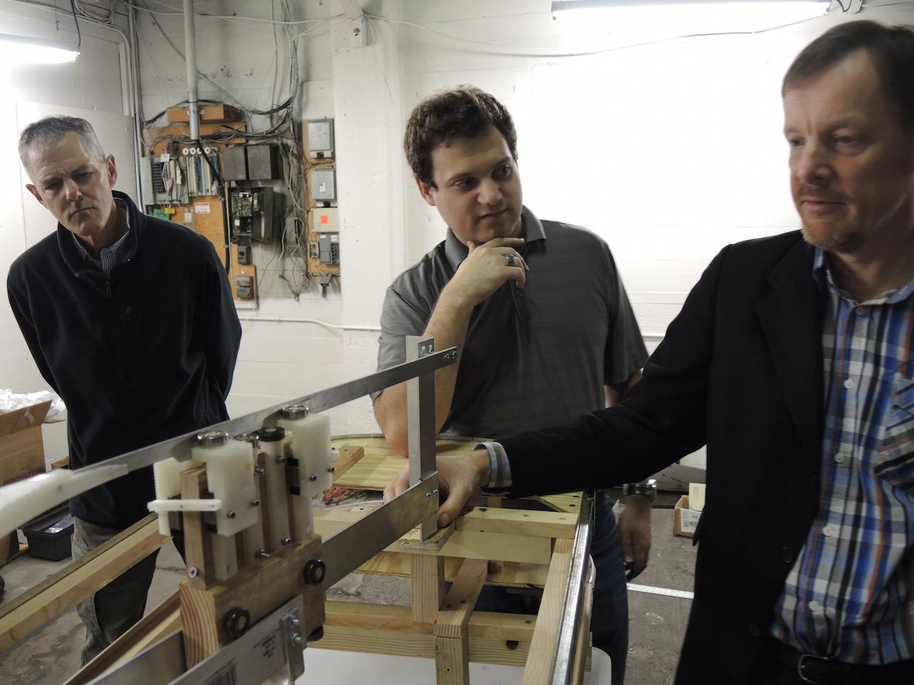 Bengt Gustafsson with a student and faculty member.